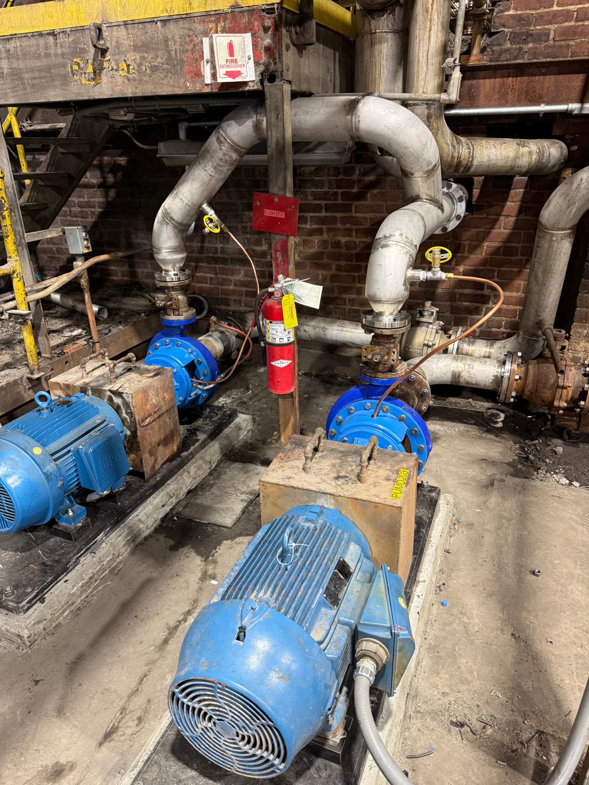 Pump station turnkey rebuild with motors, bases, and stainless steel piping